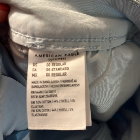 Light blue cheer style pleated miniskirt with back zip and button - Picture 5 of 7